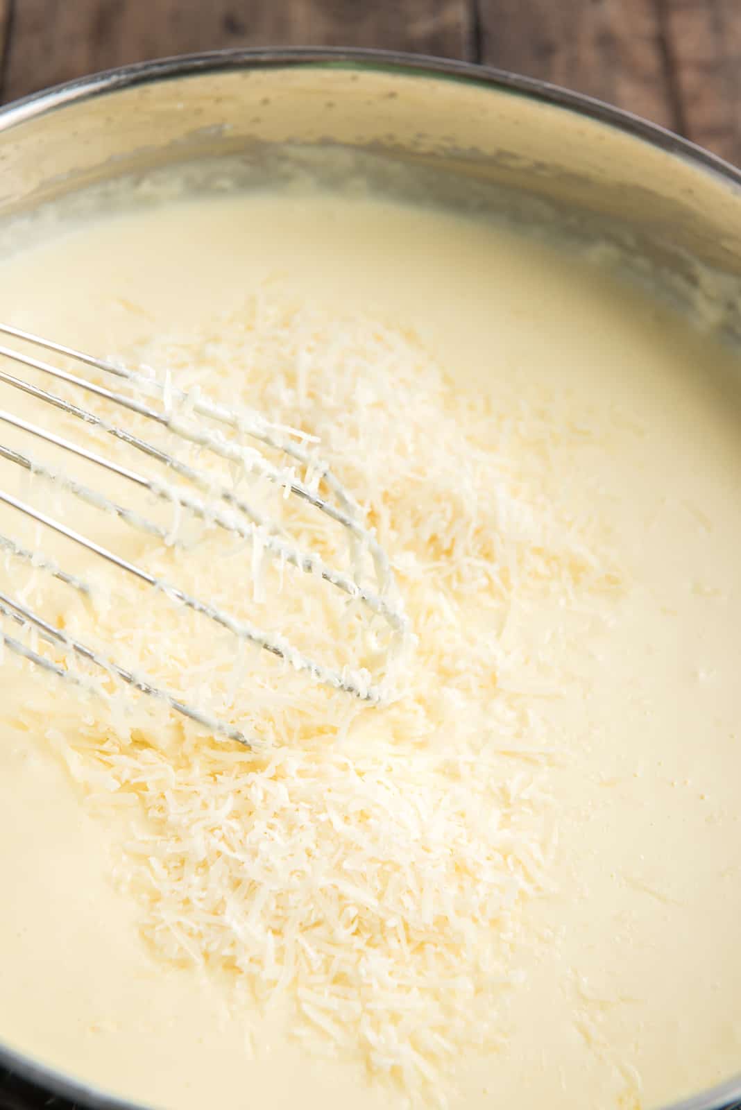 Cheeses added to butter and cream mixture.