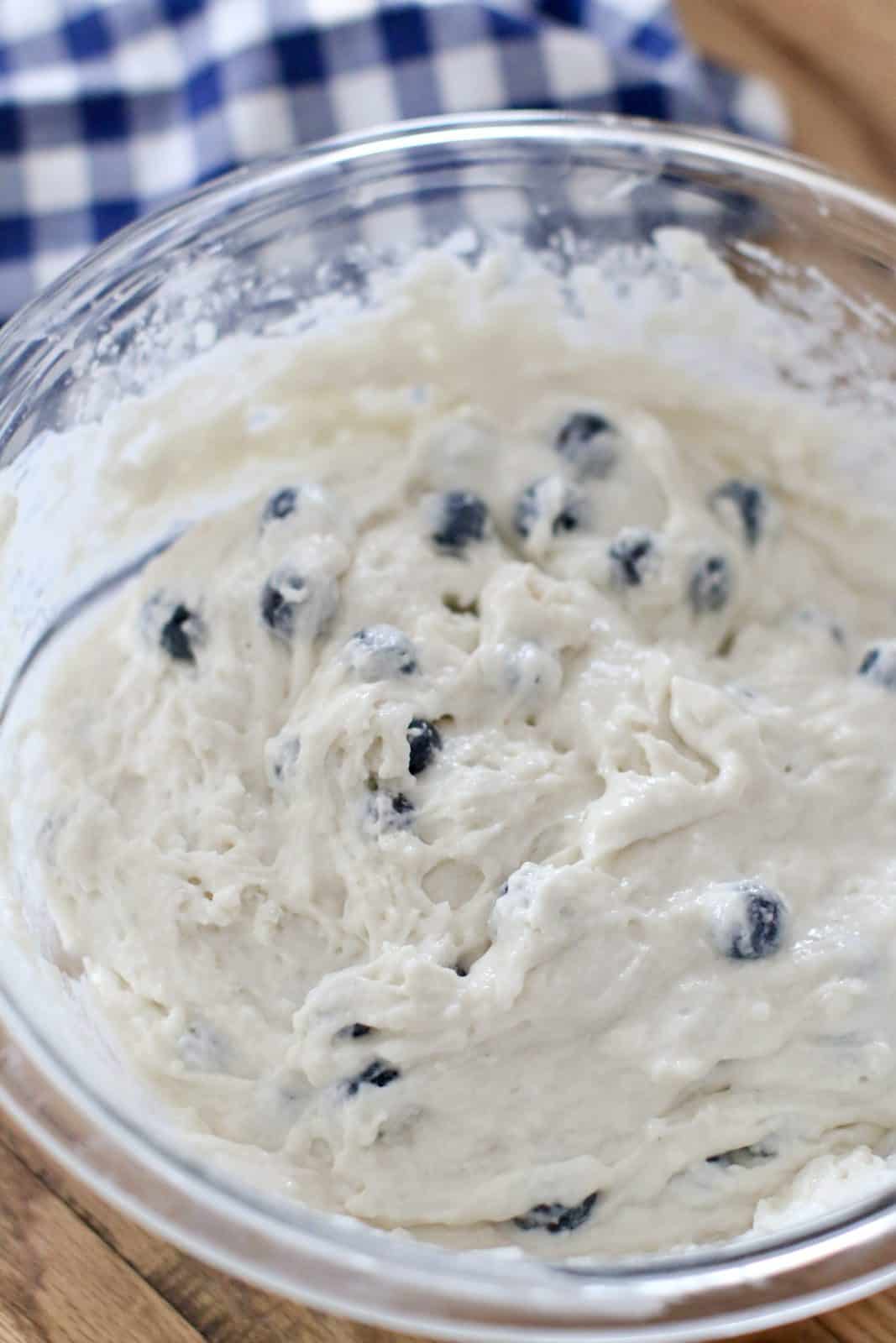 fully combined blueberry biscuit batter in a glass bowl.