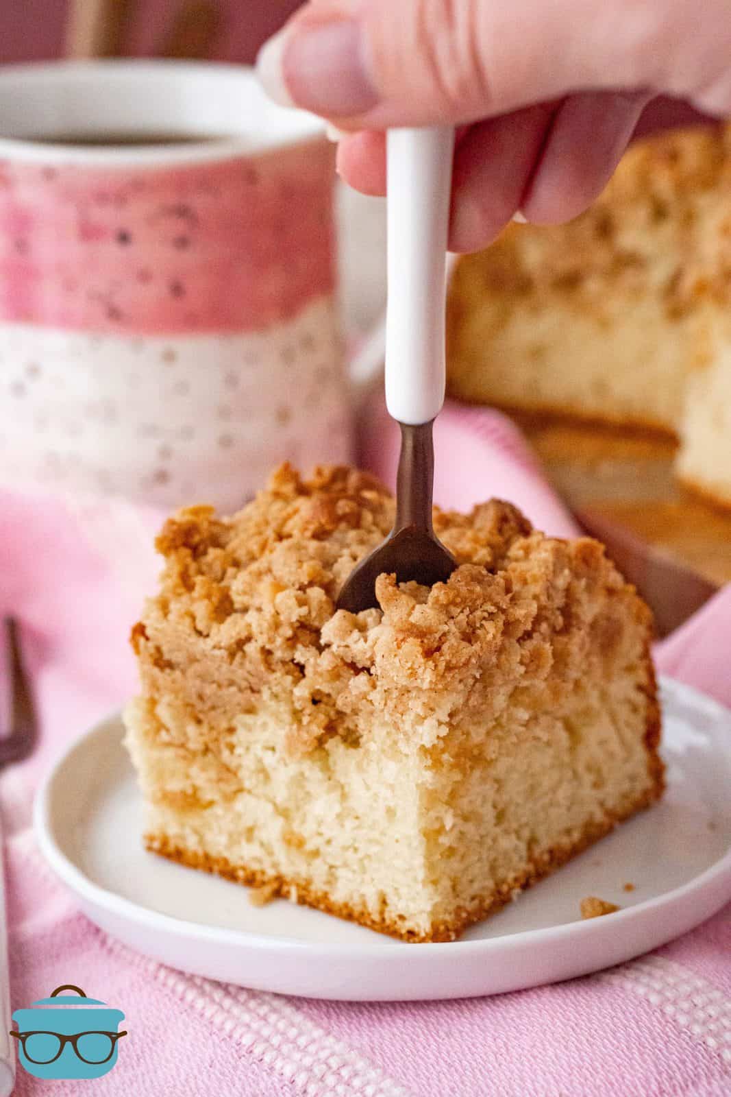 Forking going into a slice of Bisquick Coffee Cake.