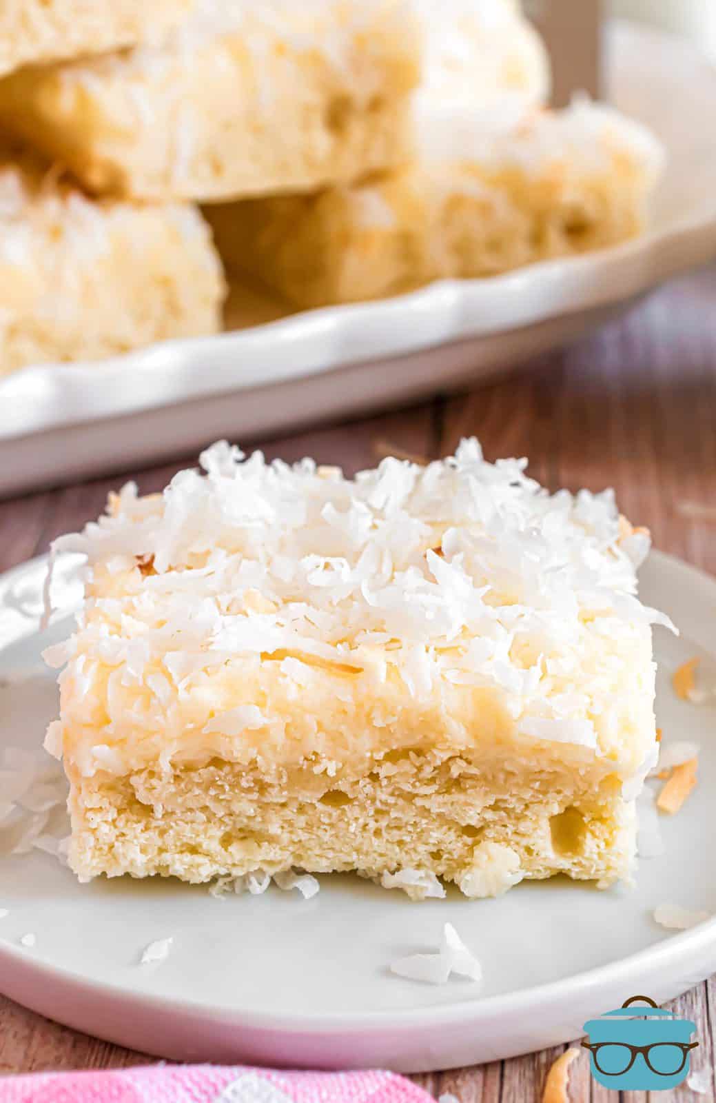 One of the Frosted Coconut Sugar Cookie Bars on a white plate.