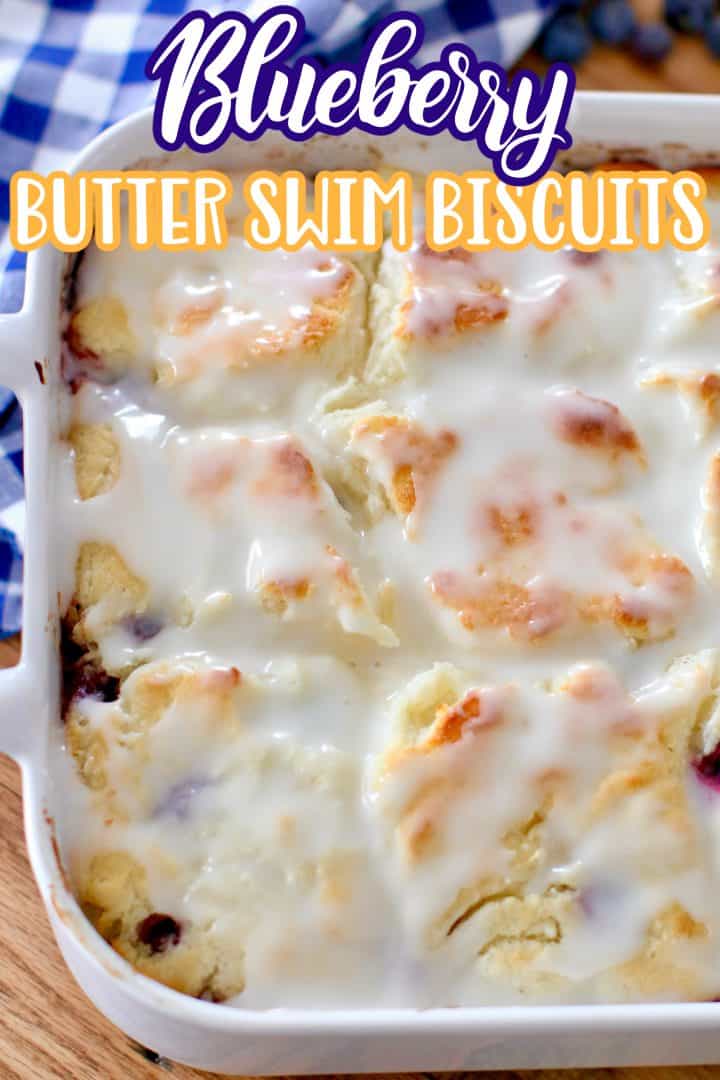 Blueberry Butter Swim Biscuits fully baked with icing in a square white baking dish.