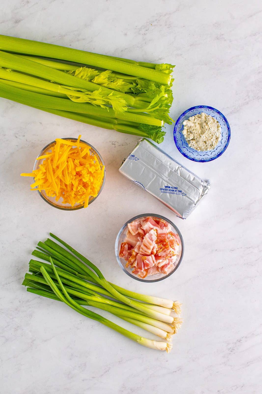 Ingredients needed: bacon, celery, cream cheese, sharp cheddar cheese, dried ranch seasoning and scallions.