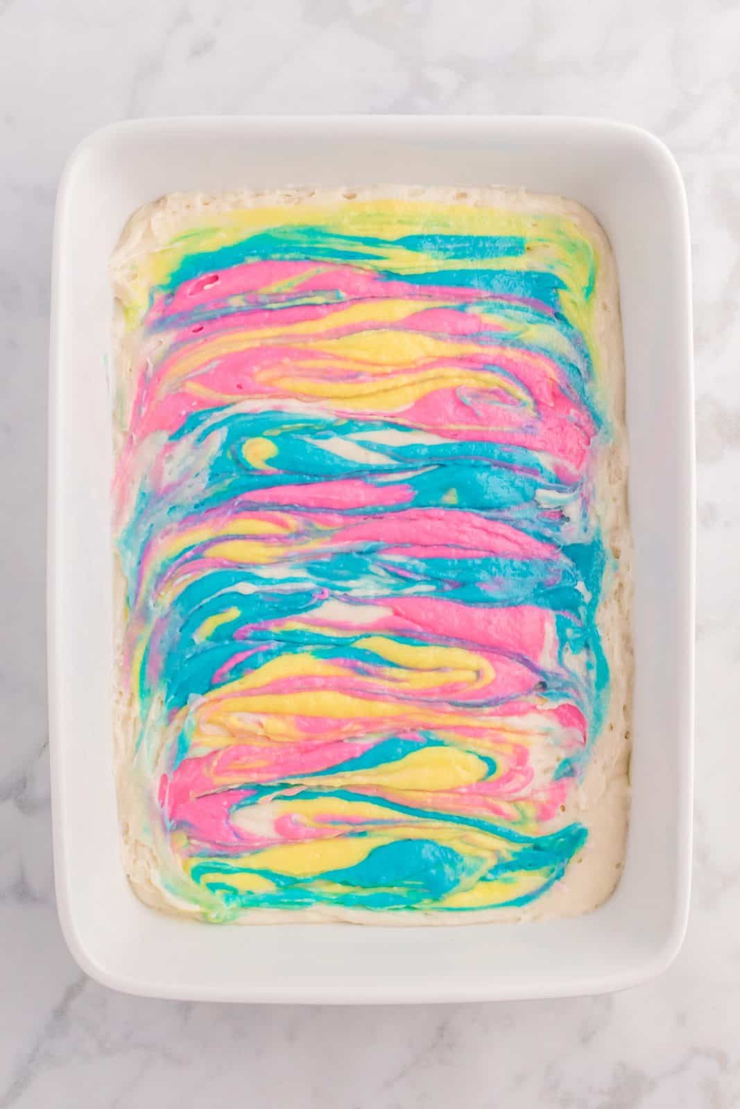 Colored cake mix swirled into cake batter.