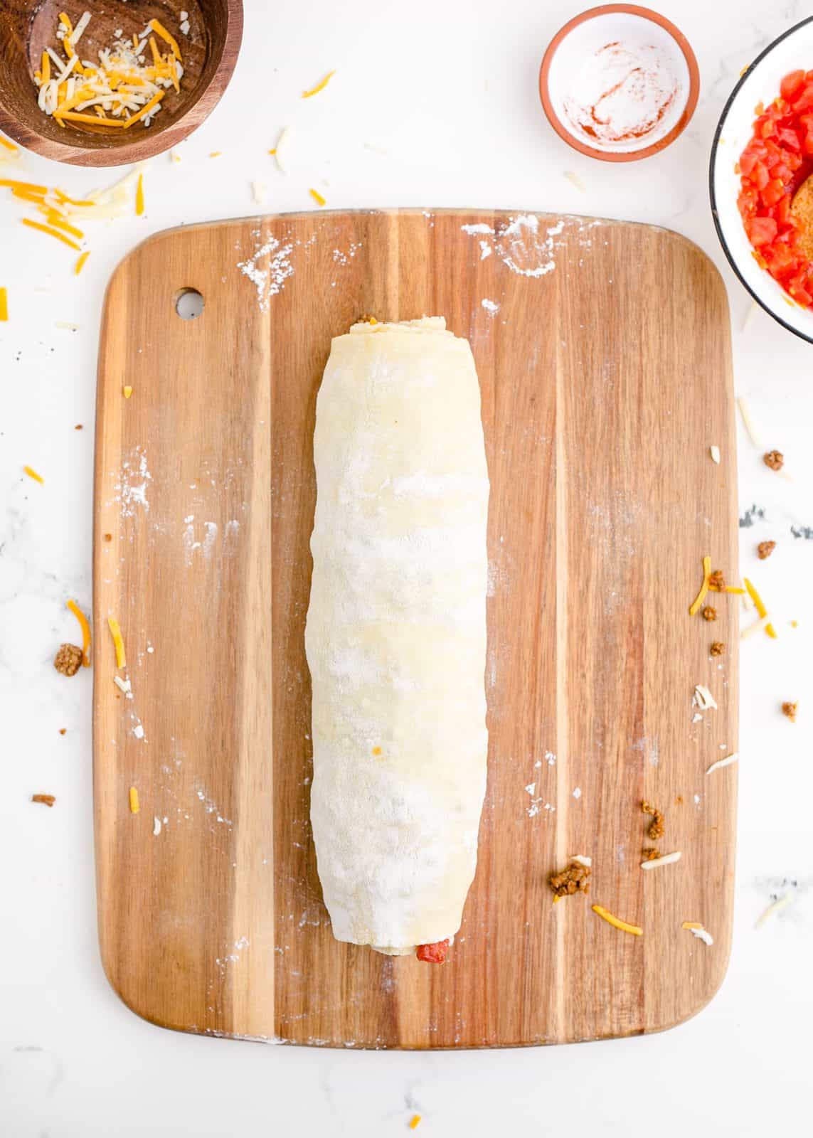 Puff pastry rolled up tightly into log.