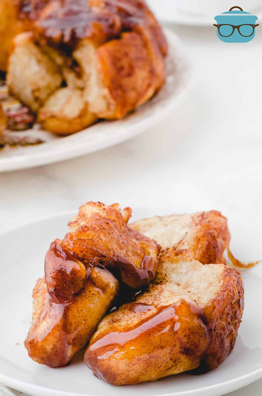 Pieces of Easy Monkey Bread pulled off onto plate.