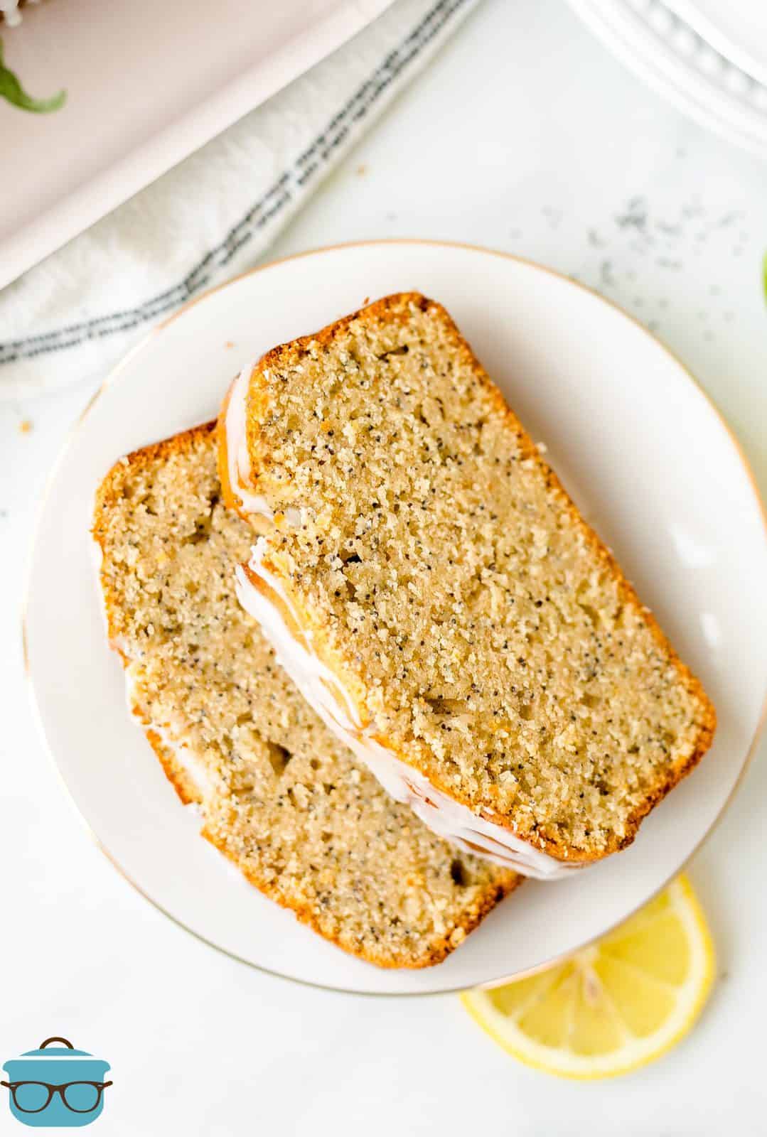 Overhead of two slices of Lemon Poppy Seed Bread on plate.