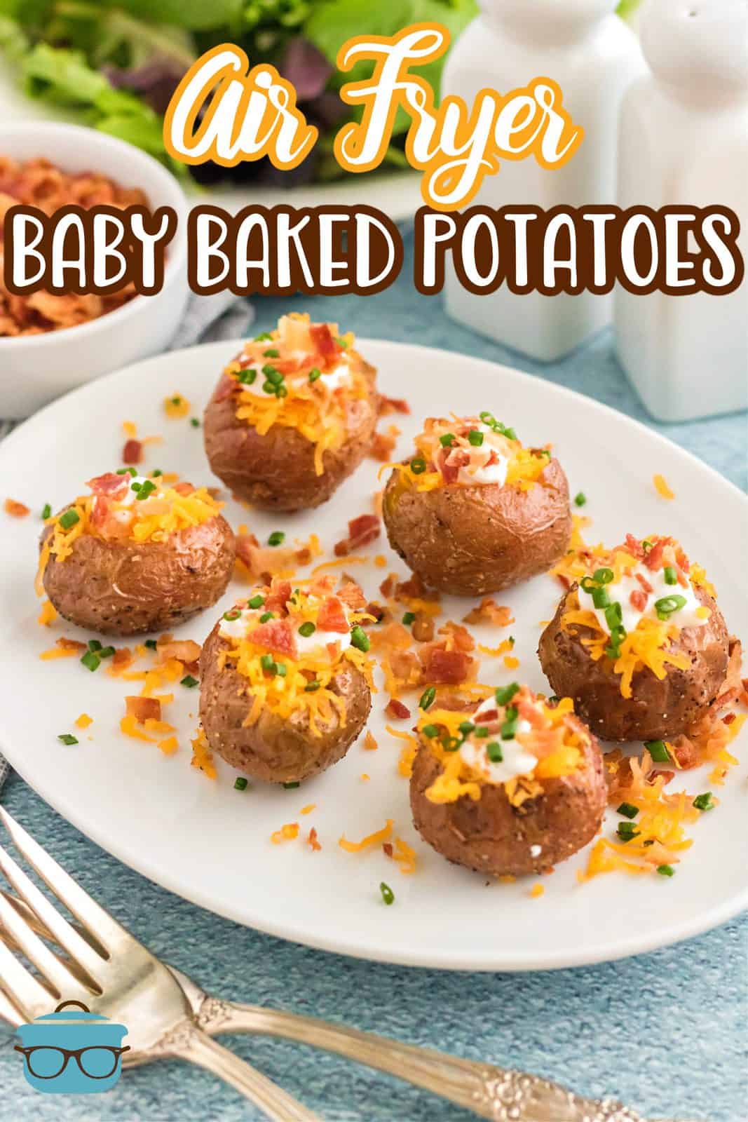 Pinterest image with garnished Air Fryer Baby Baked Potatoes on it.