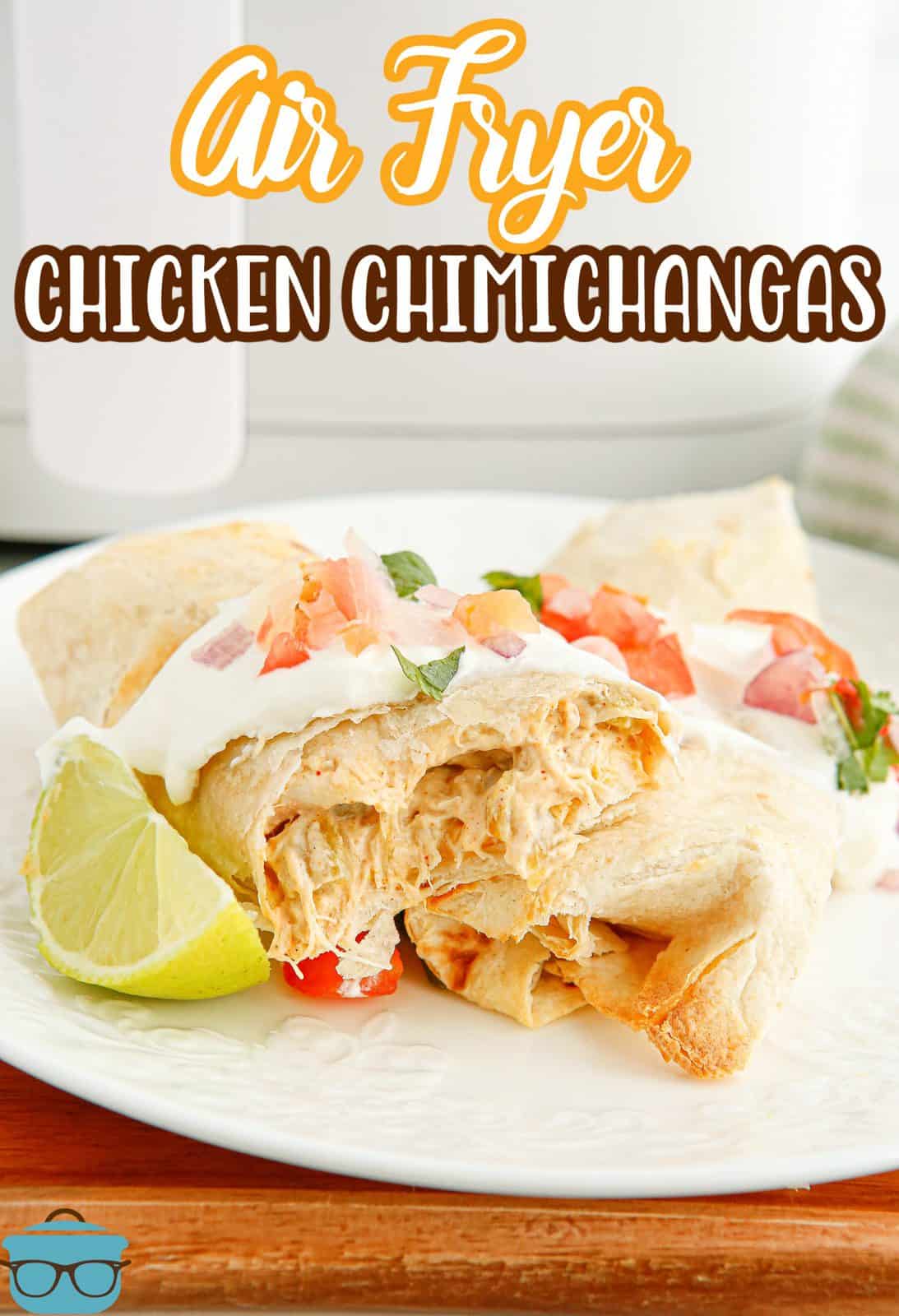 Pinterest image of finished and garnished Air Fryer Chicken Chimichangas cut open showing inside.