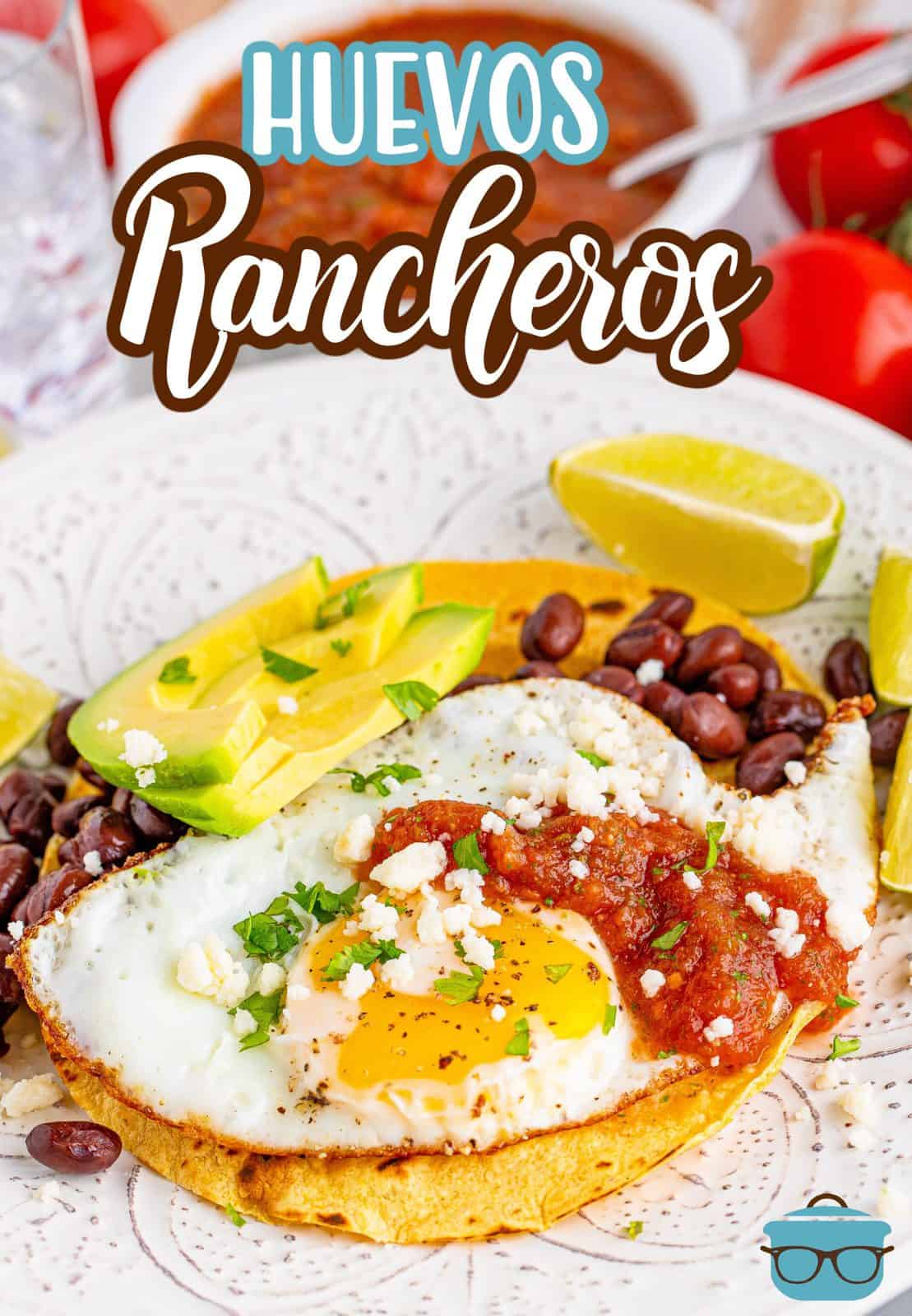 Pinterest image of Huevos Rancheros on plate showing all the toppings.
