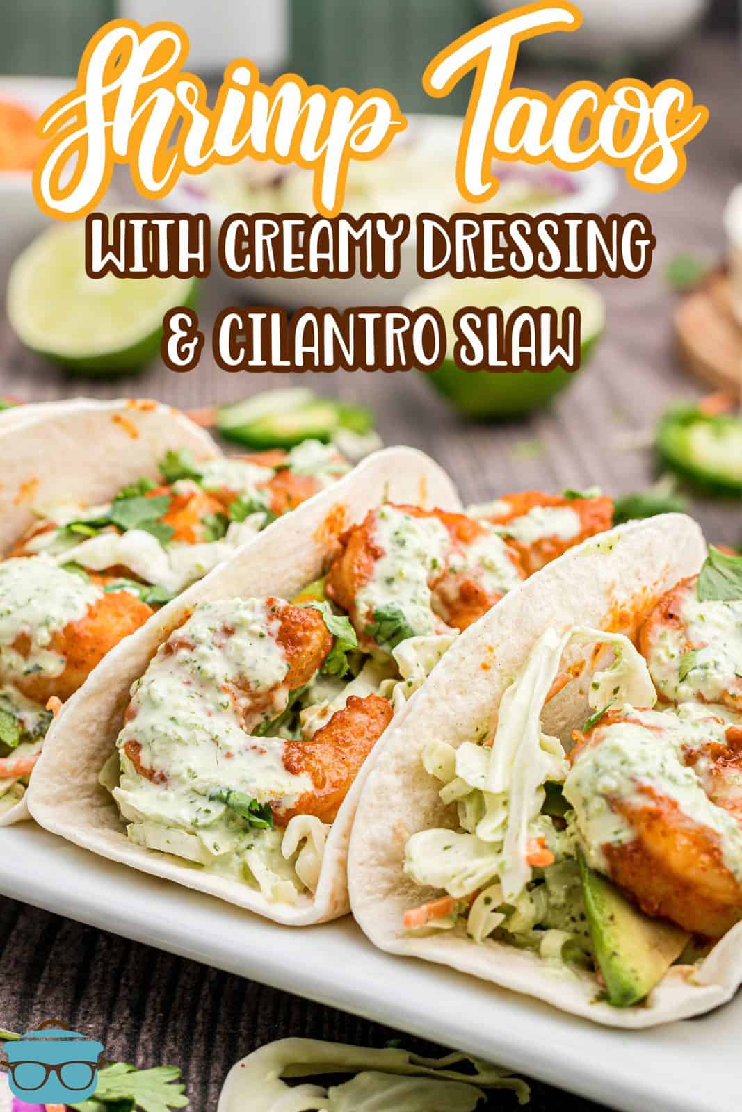 Pinterest image of Shrimp Tacos on white platter topped with slaw.