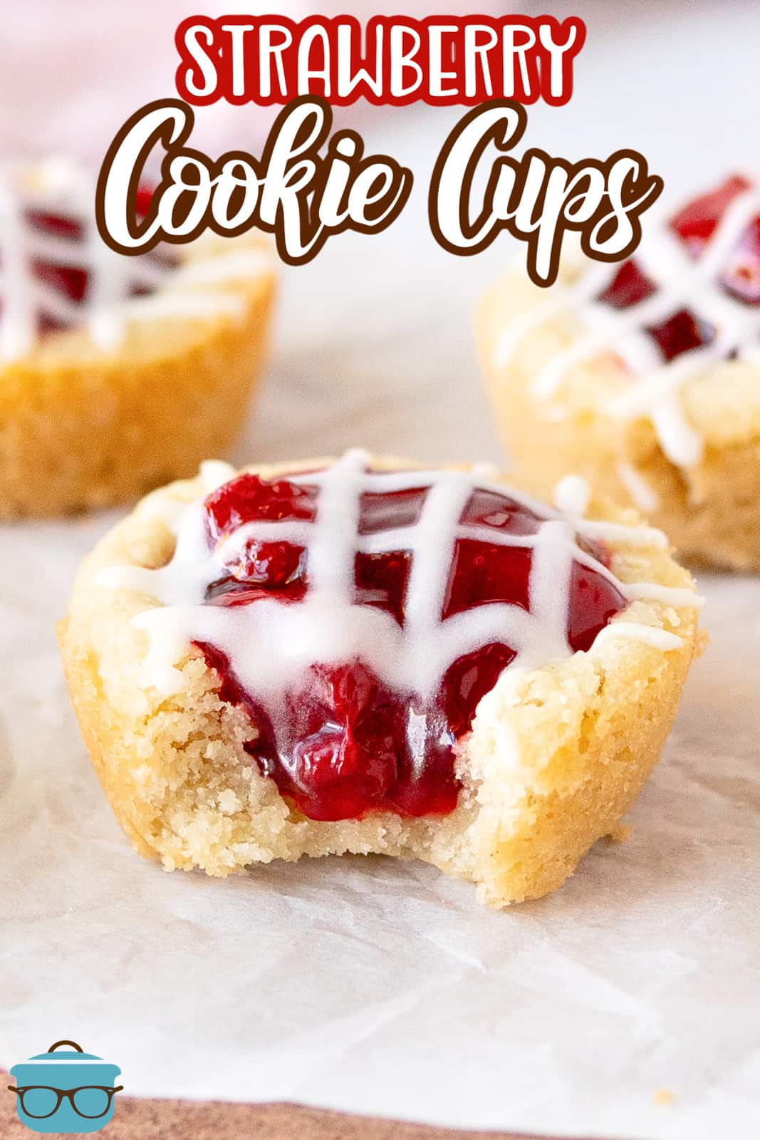 Pinterest image of Strawberry Cookie Cups with front one having a bite out of it.