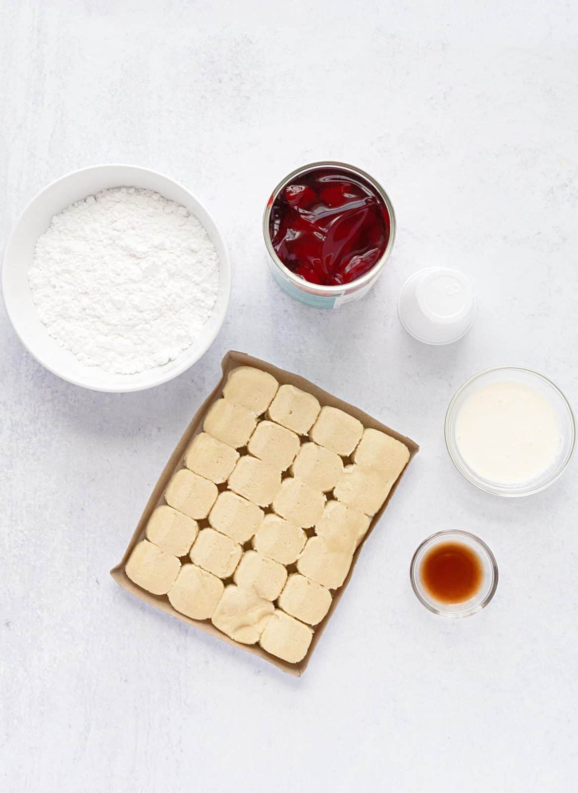 Ingredients needed: sugar cookie dough, strawberry pie filling, powdered sugar, heavy cream and vanilla extract.