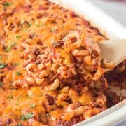 Square image of serving spoon lifting out some of the Cheeseburger Macaroni Casserole.