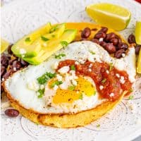 Square image of finished and plated Huevos Rancheros.