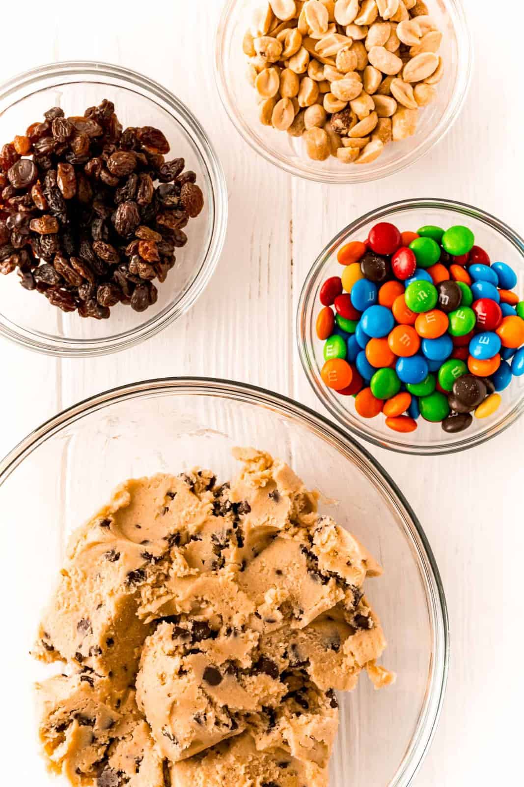 Ingredients needed: refrigerated chocolate chip cookie dough, M&M’s, salted dry roasted peanuts and raisins.