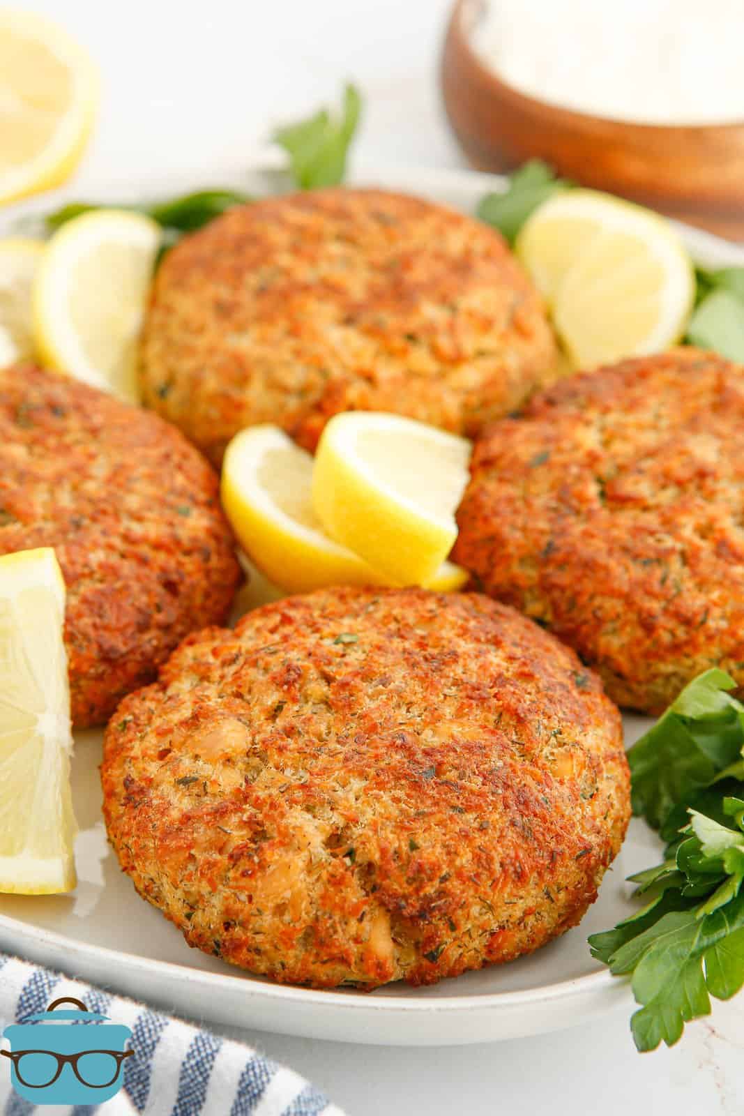 Air Fryer Salmon Patties on plate with lemon slices.