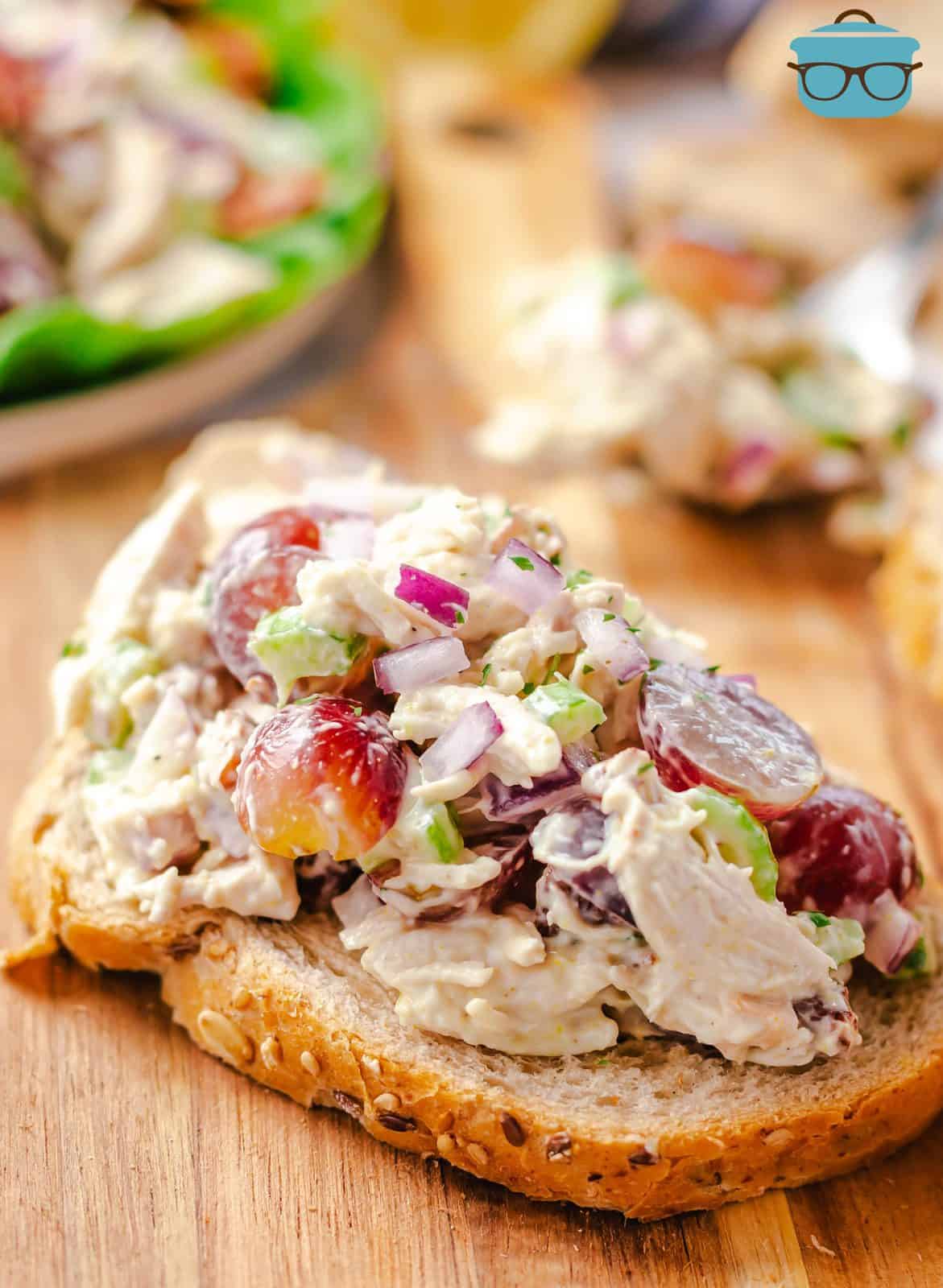 Close up of Grape Chicken Salad on slice of bread showing all the ingredients.