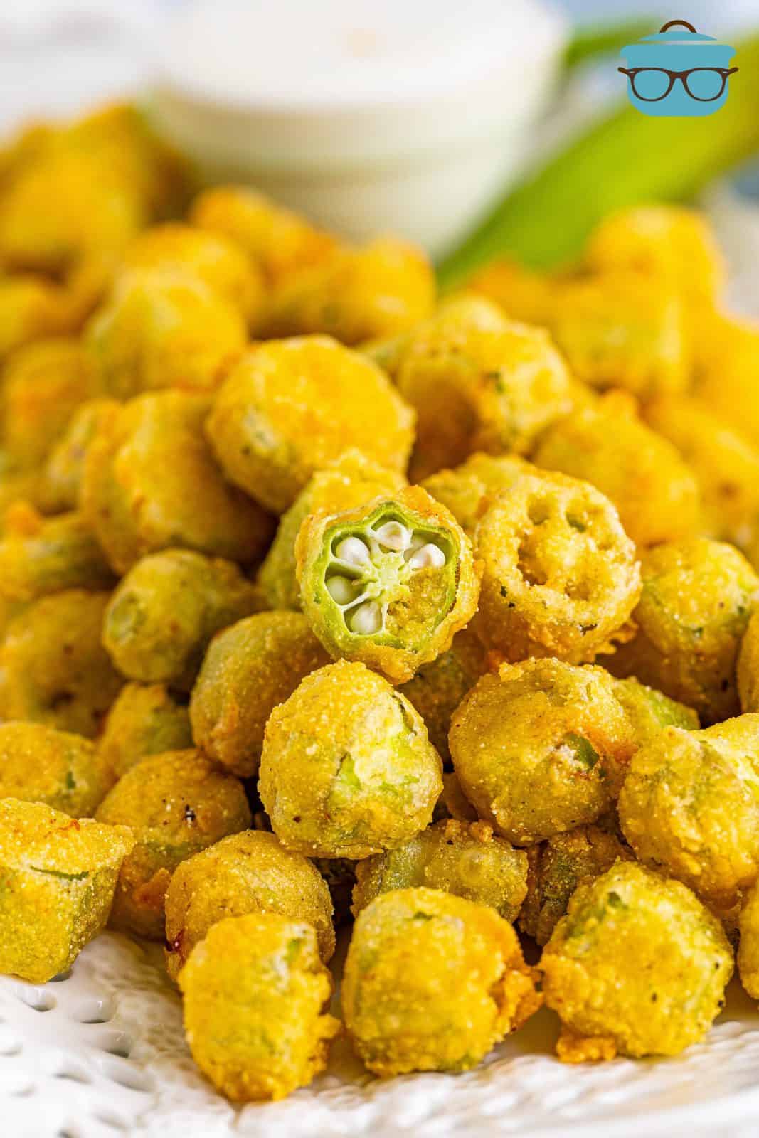 close up of Fried Okra with one cut in half showing the inside.