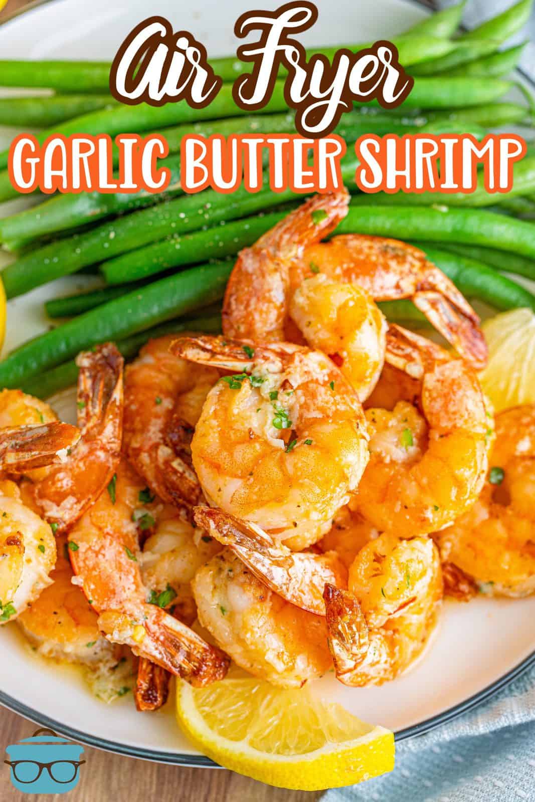 Pinterest image of Air Fryer Garlic Butter Shrimp on plate with green beans and lemon slices.