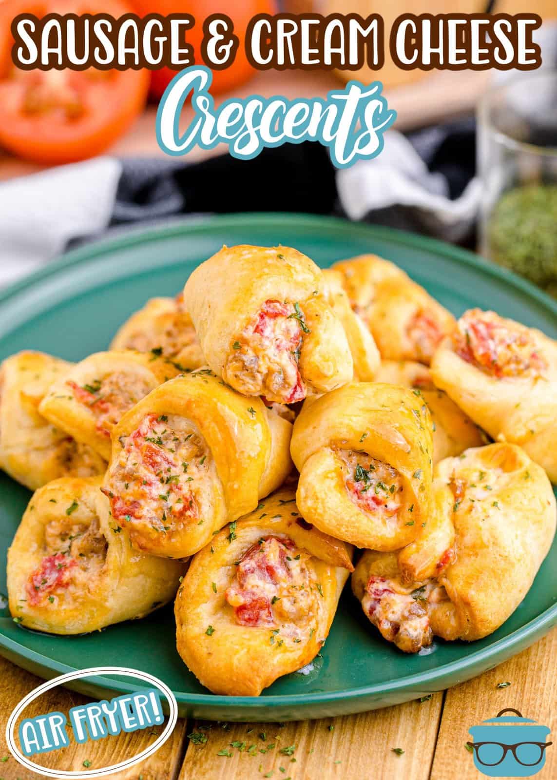 Pinterest image of Air Fryer Sausage and Cream Cheese Crescents on green plate with ingredients in background.