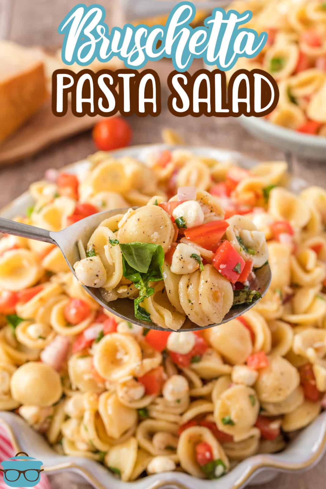 Spoon holding up some of the Bruschetta Pasta Salad from bowl Pinterest image.