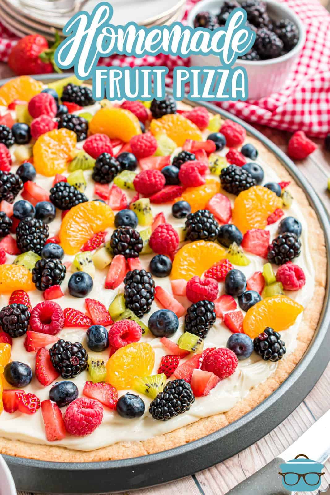 Pinterest image of close up side view of the decorated Homemade Fruit Pizza.