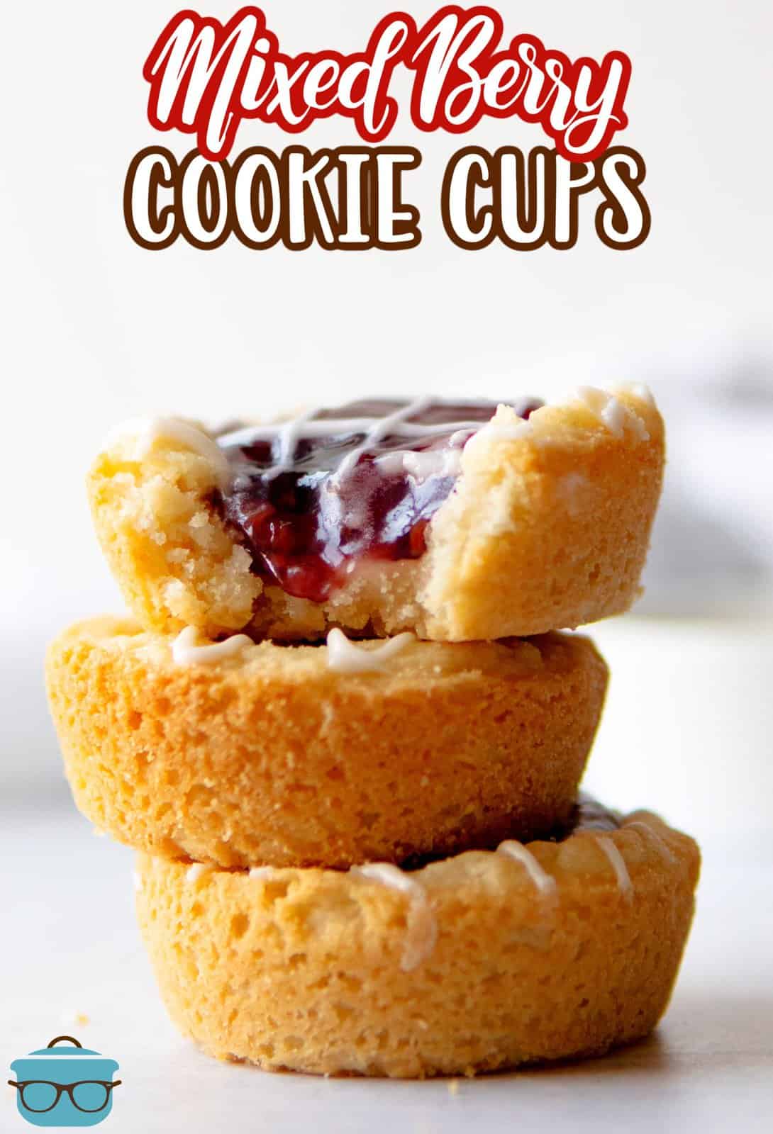 Pinterest image of stacked Berry Cookie Cups with bite taken out of top one.