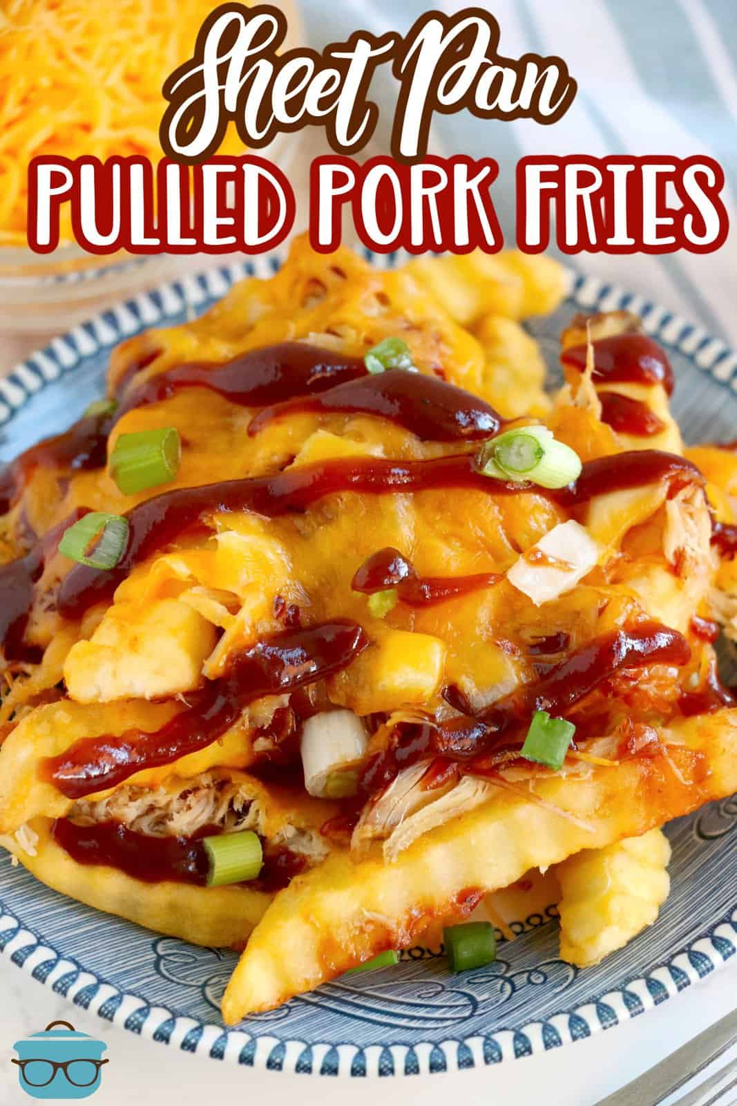 Pinterest image of Sheet Pan Pulled Pork French Fries on plate drizzled with bbq sauce.