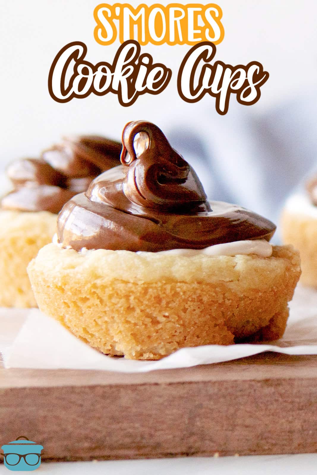 Pinterest image close up of S'mores Cookie Cups showing the nutella on top.