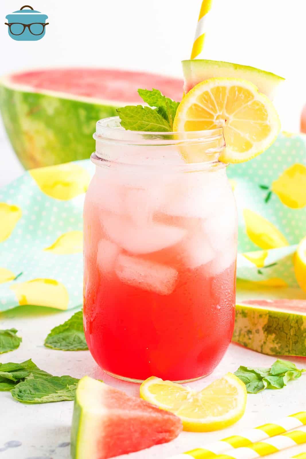 Watermelon Mocktail in glass with ice garnished with lemon, watermelon and mint.