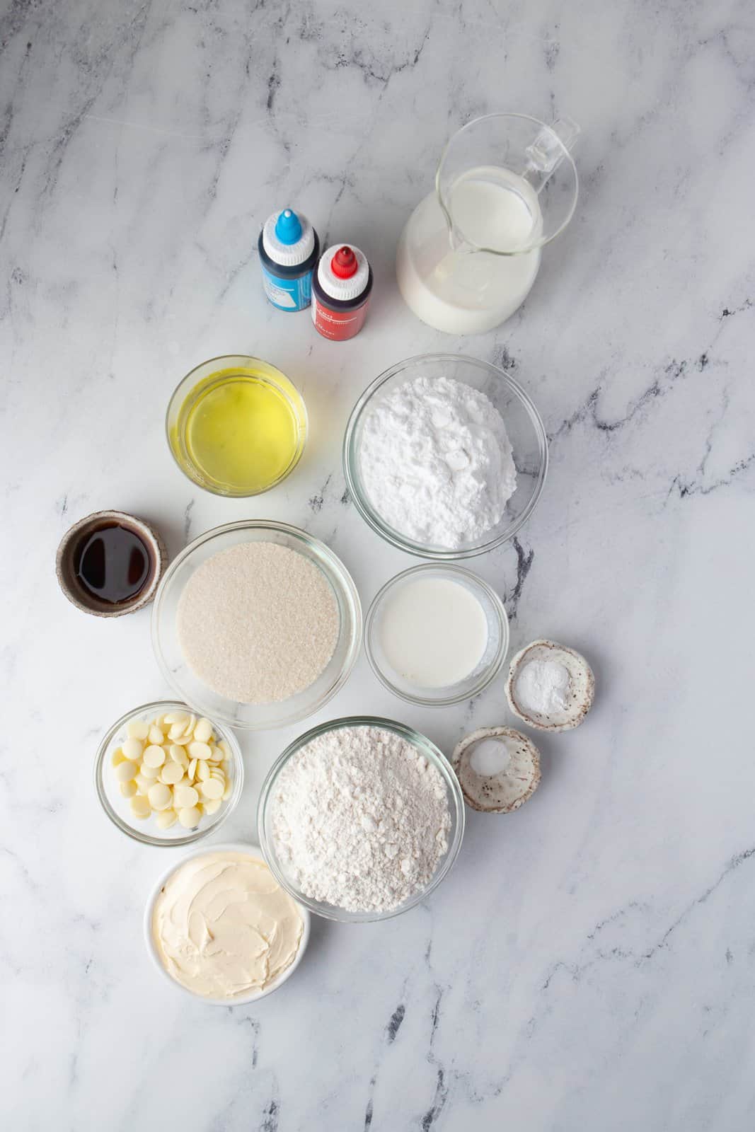 Ingredients needed: butter, granulated sugar, egg whites, baking powder, baking soda, all-purpose flour, vanilla, milk, white chocolate, powdered sugar, whipping cream and food coloring.
