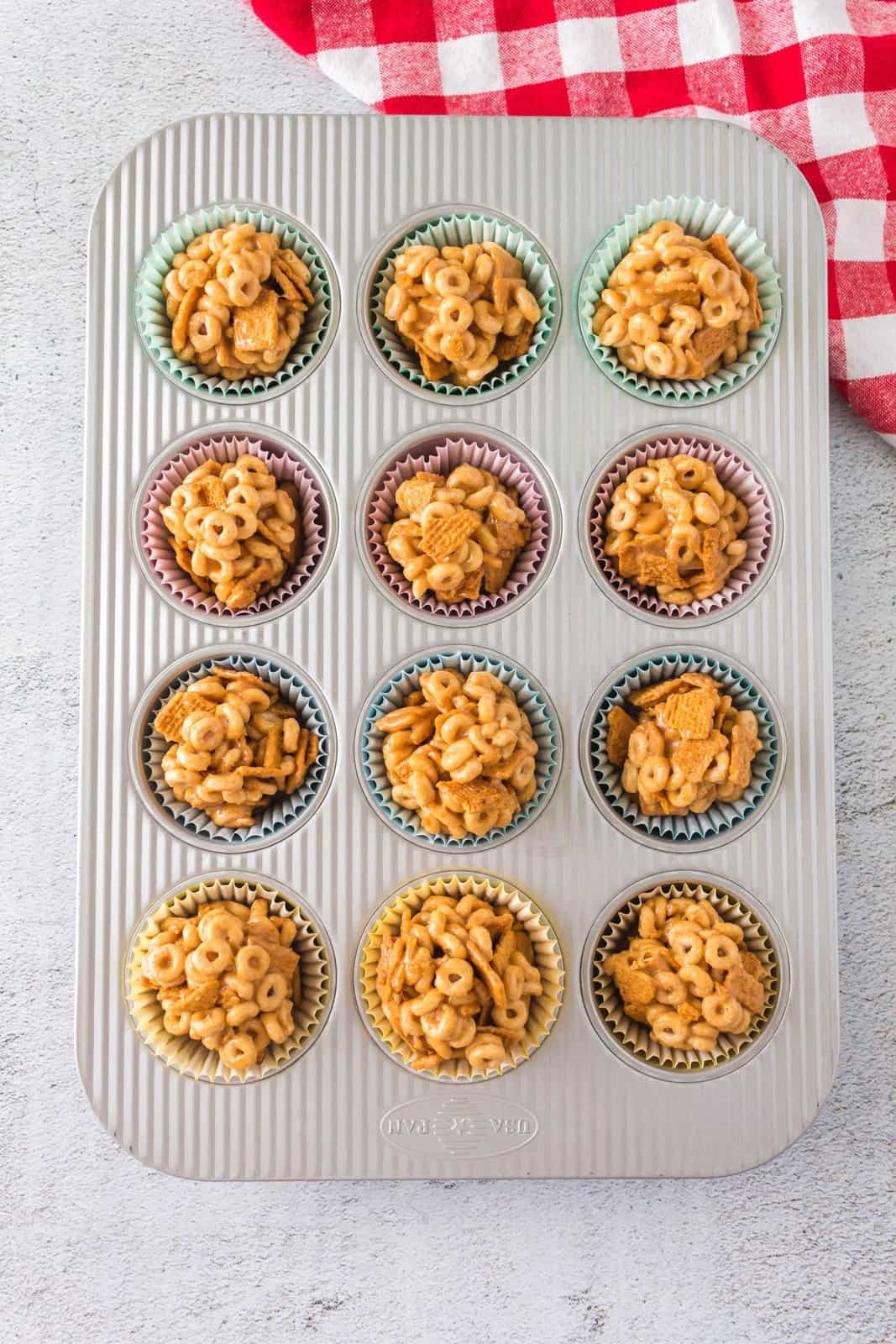 Cheerio Balls in liners in muffin tiin.