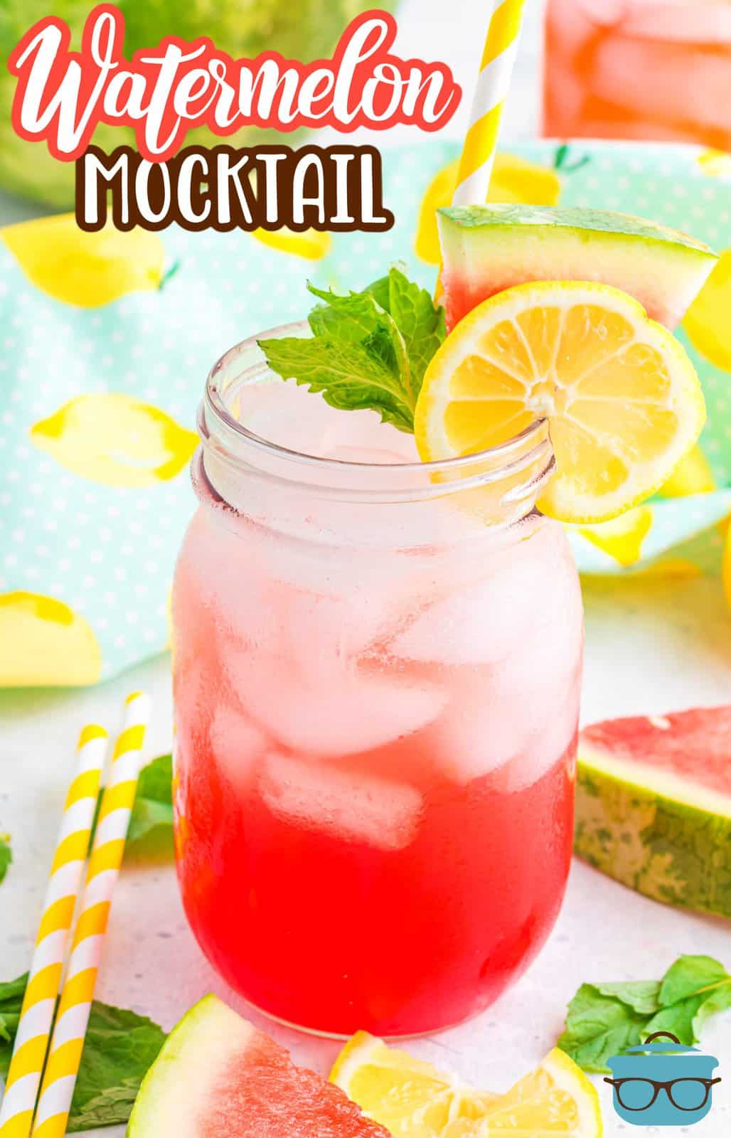 Pinterest image of finished Watermelon Mocktail Recipe in glass with ice and garnishes with fruit and mint behind it.
