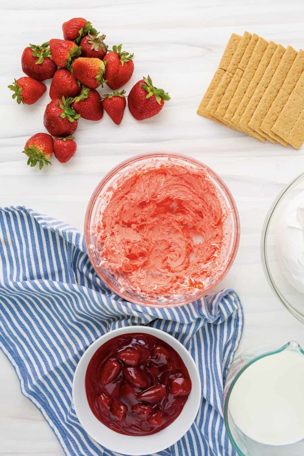 Cream cheese blended in bowl with jello.