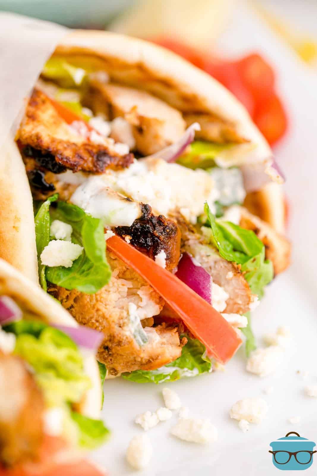 Close up of one of the Chicken Gyros showing the filling ingredients.