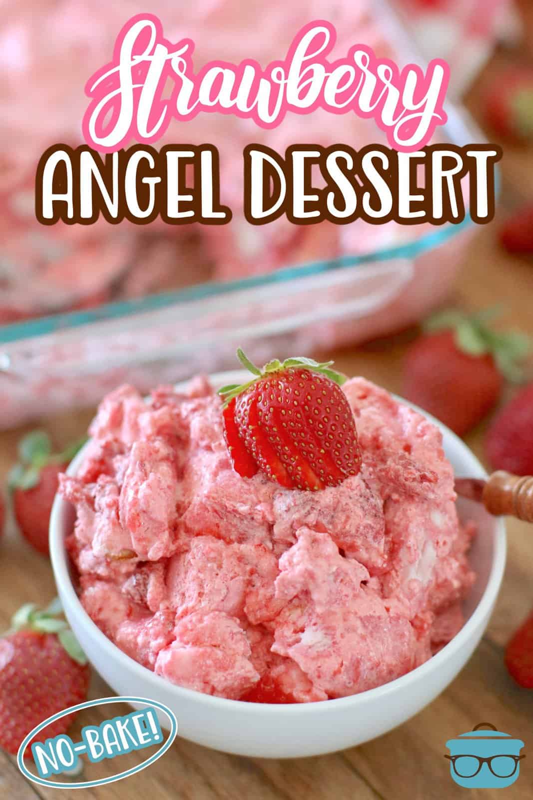 a white bowl filled with strawberry angel food cake dessert topped with a fresh sliced strawberry.
