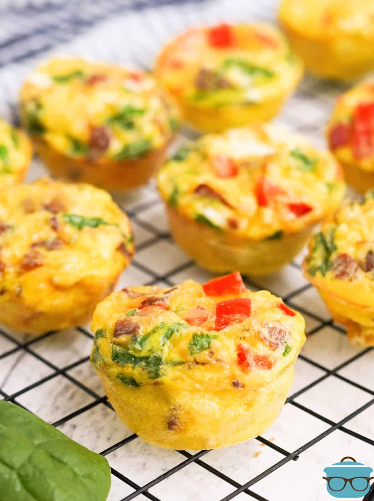 Finished Breakfast Egg Muffins on wire rack cooling.
