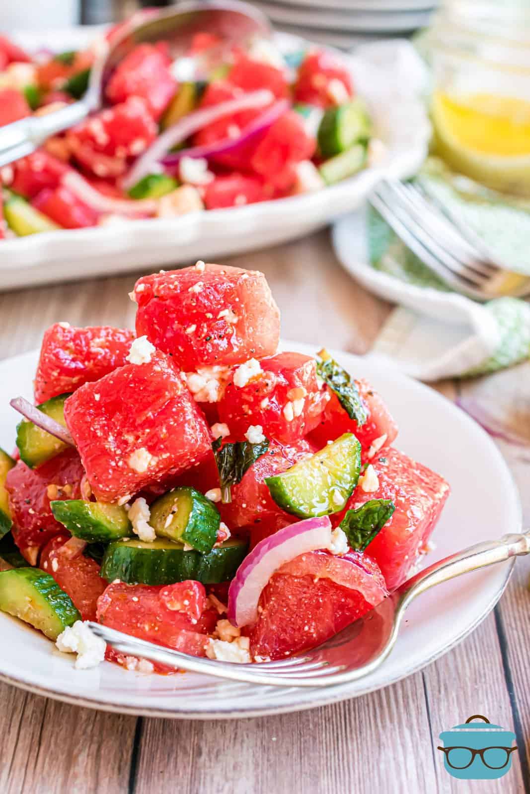 Watermelon Salad on white plate with fork.