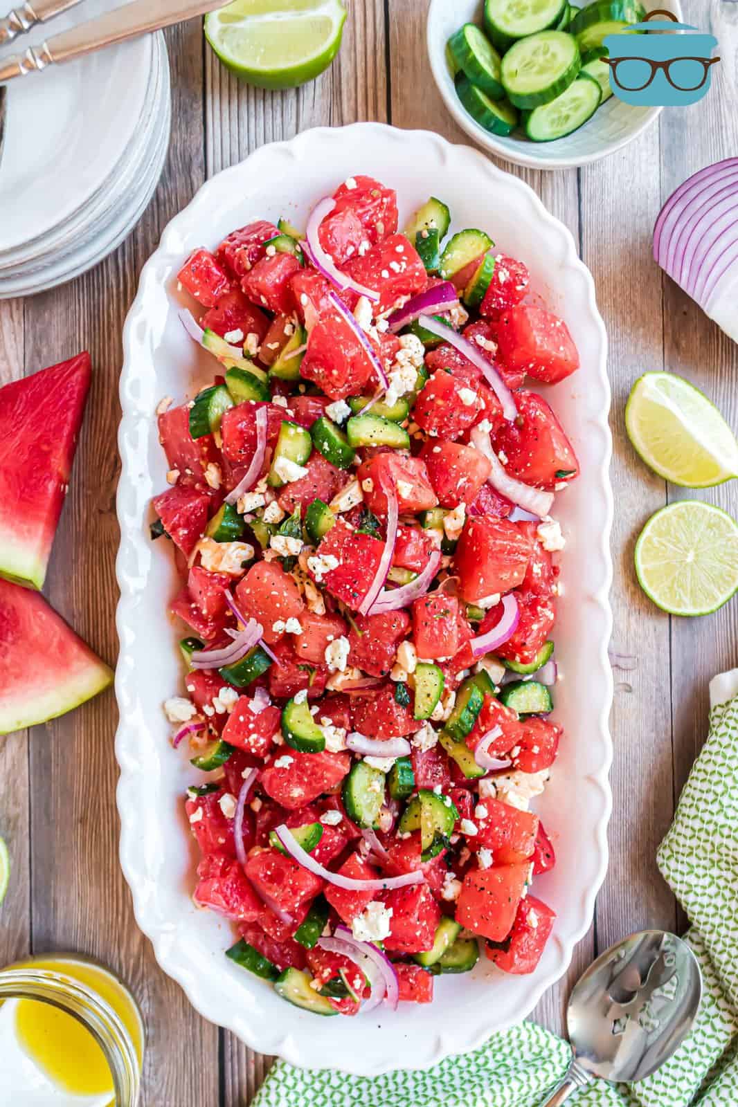 Overhead of watermelon salad on white serving tray.