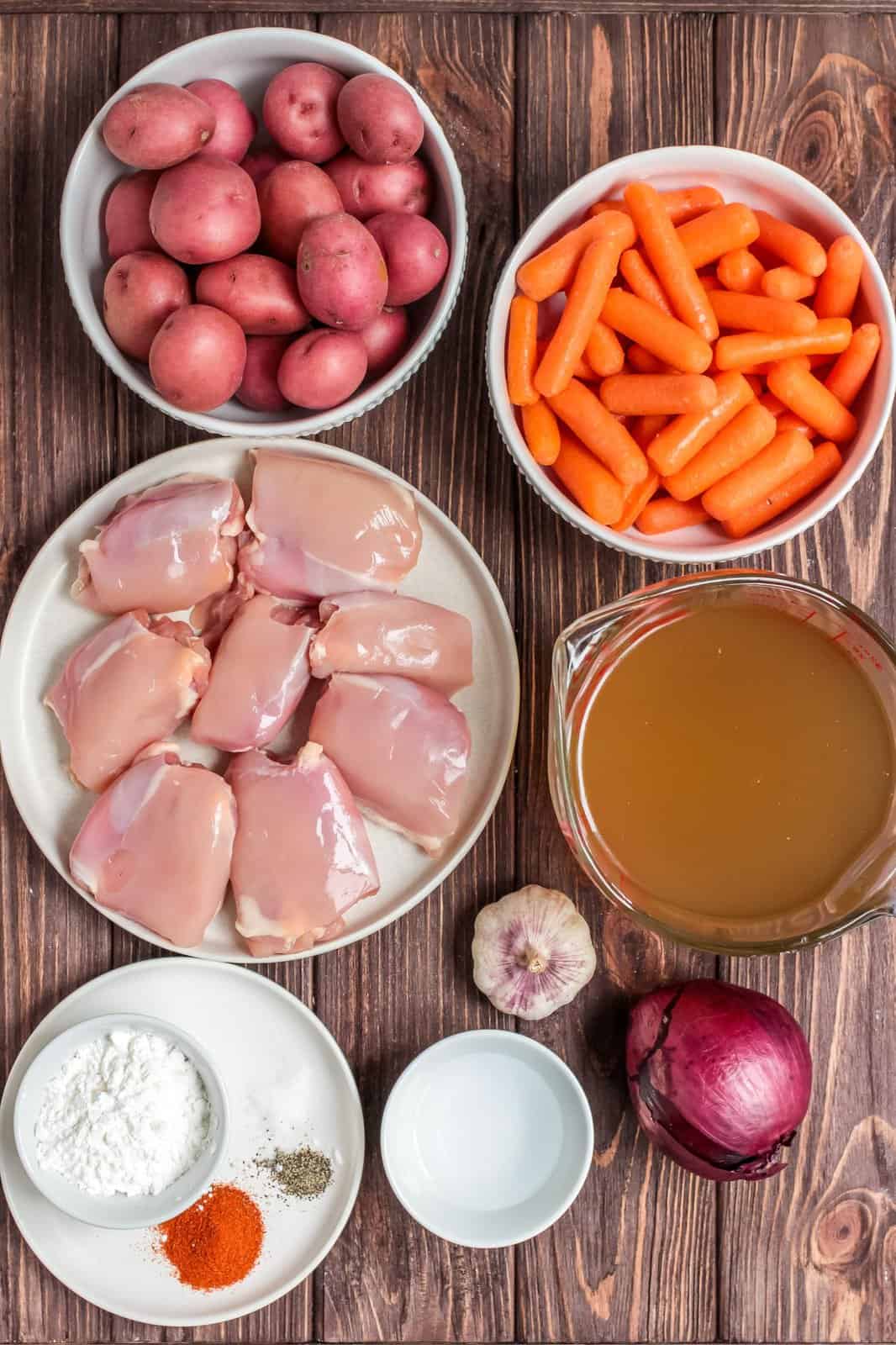 Ingredients needed: chicken thighs, paprika, salt, pepper, vegetable oil, baby red potatoes, baby carrots, red onion, garlic, chicken broth, cornstarch and water.