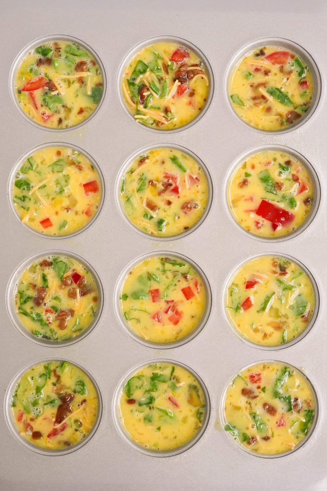 Egg mixture put into wells of muffin tin.