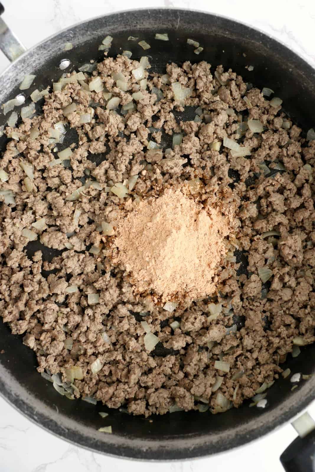 Dry spaghetti sauce mix added to ground beef mixture.