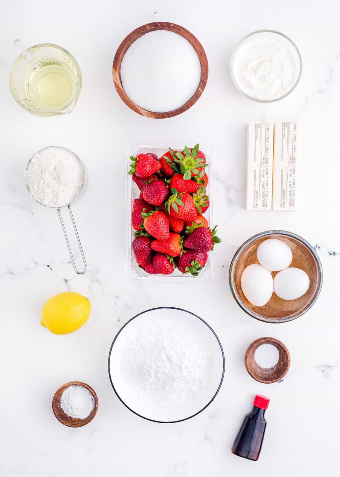 Ingredients needed: strawberries, granulated sugar, lemon juice, all-purpose flour, baking powder, baking soda, salted butter, vegetable oil, vanilla extract, eggs, strawberry reduction, sour cream and powdered sugar.