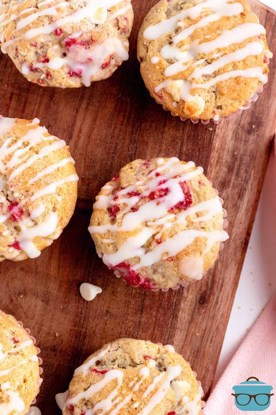 Overhead image of glazed Raspberry White Chocolate Muffins.