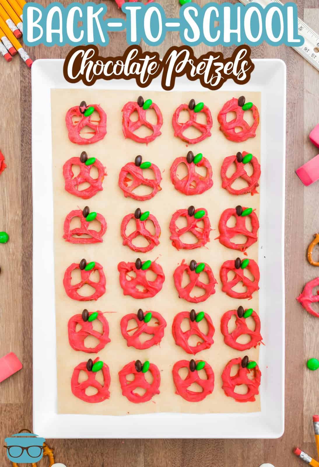 Pinterest image of Back-to-School Chocolate Covered Pretzels on white tray overhead.