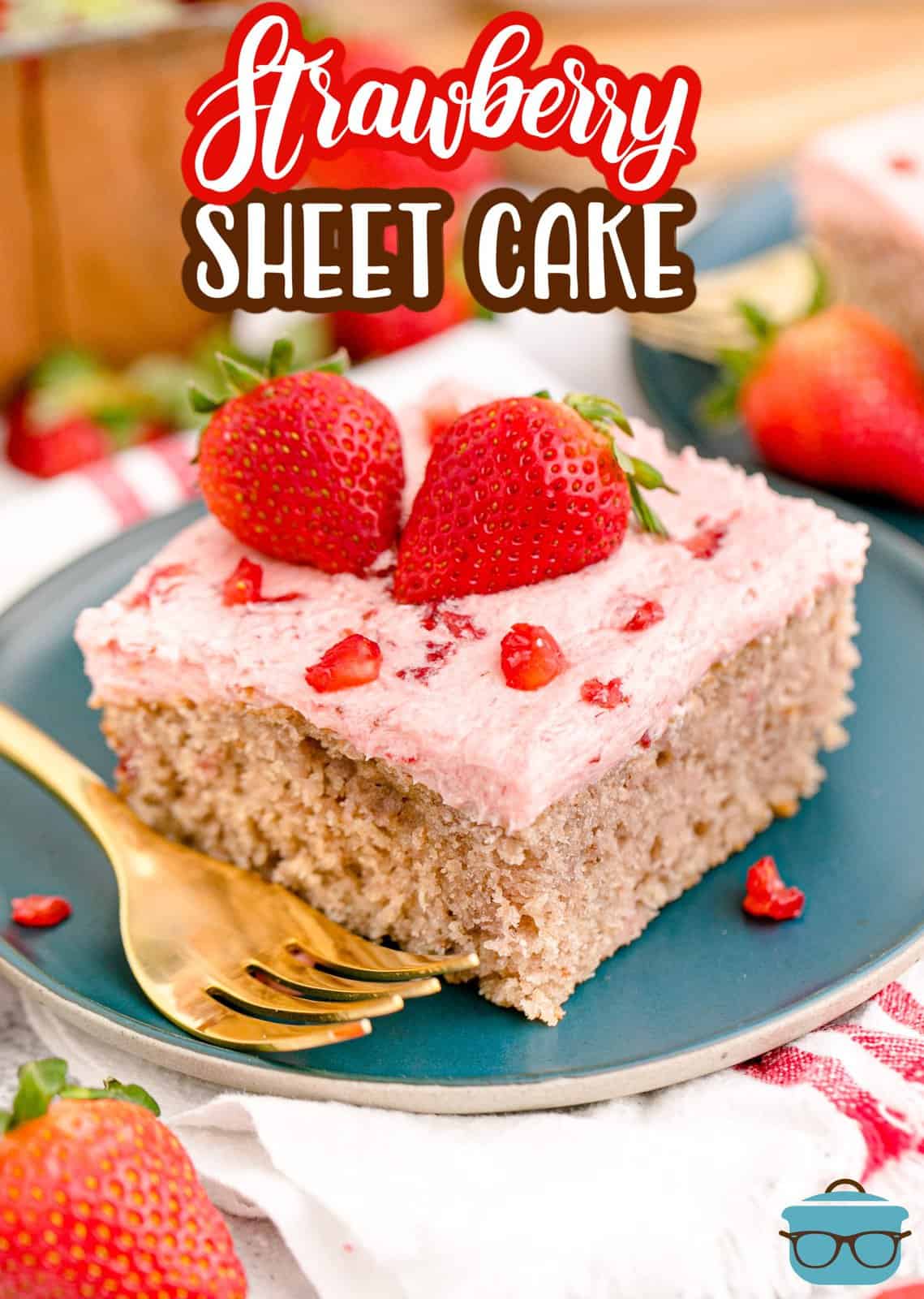 Pinterest image of slice of Fresh Strawberry Cake on green plate with gold fork with strawberry halves on top.