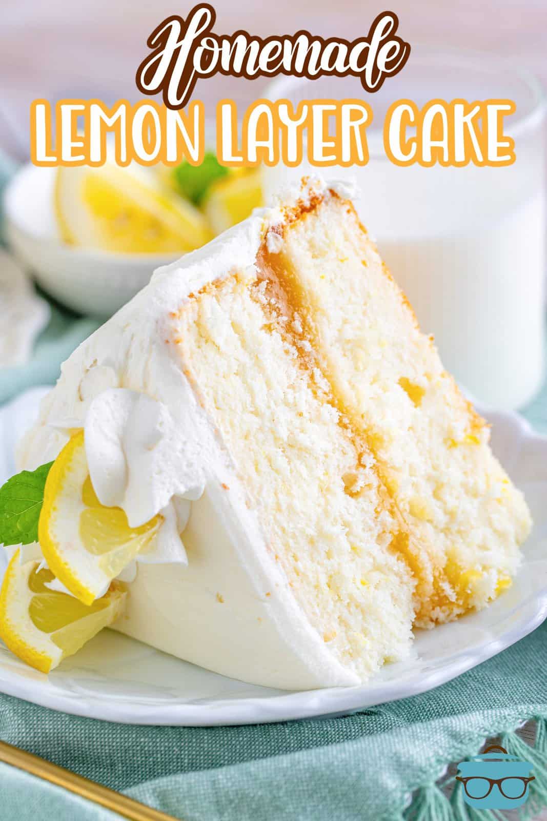 Close up of slice of Lemon Layer Cake on white plate Pinterest image.