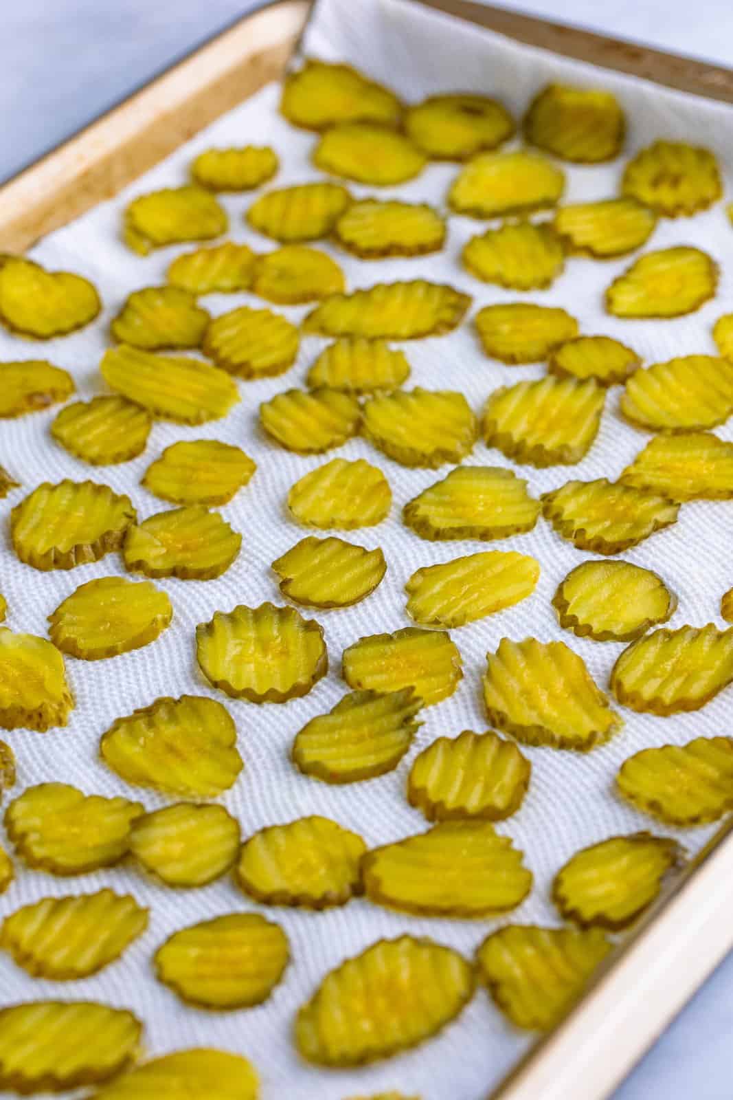 Pickles drying on paper towel.