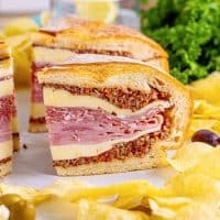 Close up square image of a slice of the Muffaletta Sandwich.