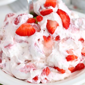 Close up of Strawberry Cheesecake Fluff in bowl showing garnish.